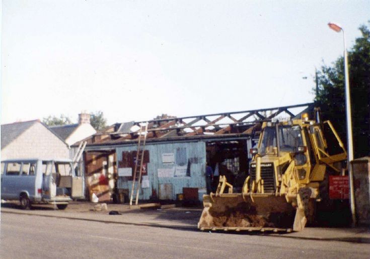 Demolishing the old Campbell's Garage. 