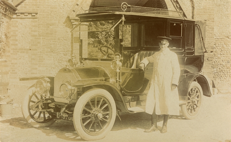 Old car and chauffeur